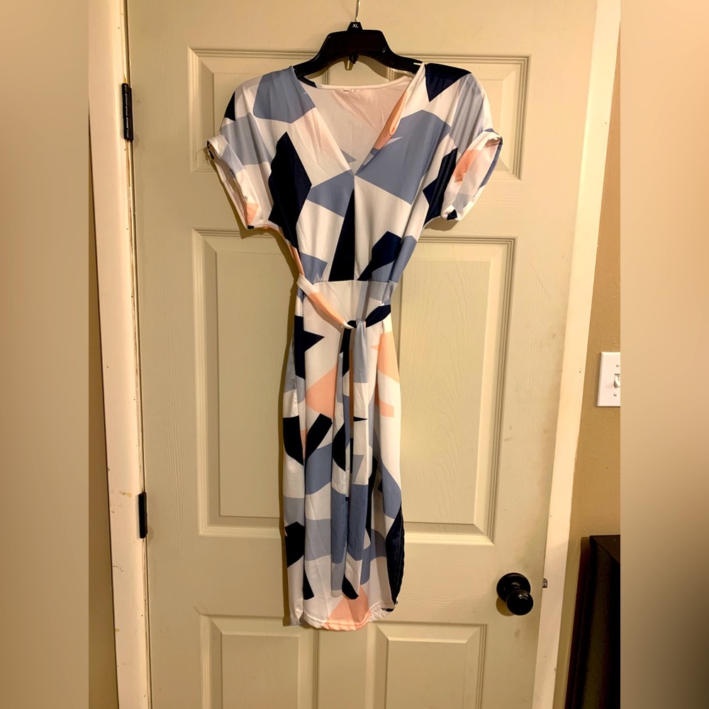 Soft black, blue, white, pink dress with tie around. Accentuate your figure
